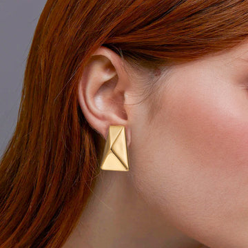 Golden, long trapezoidal, thick and heavy earrings