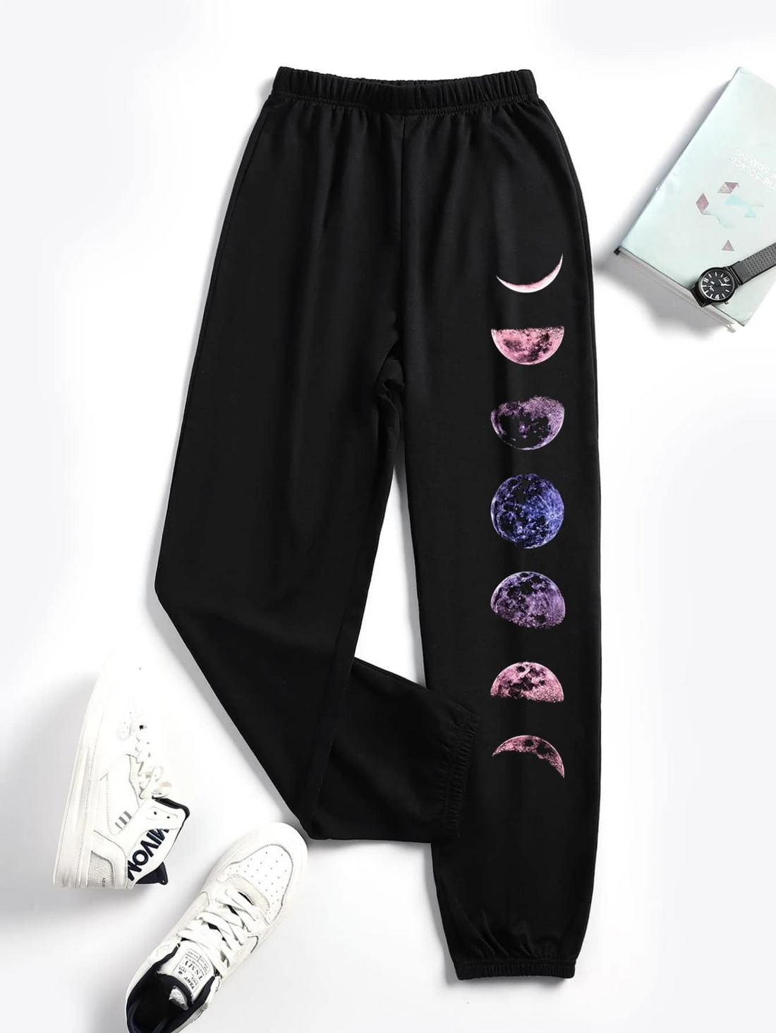 Black, women's casual pants with 6 moon changing patterns on the pant legs
