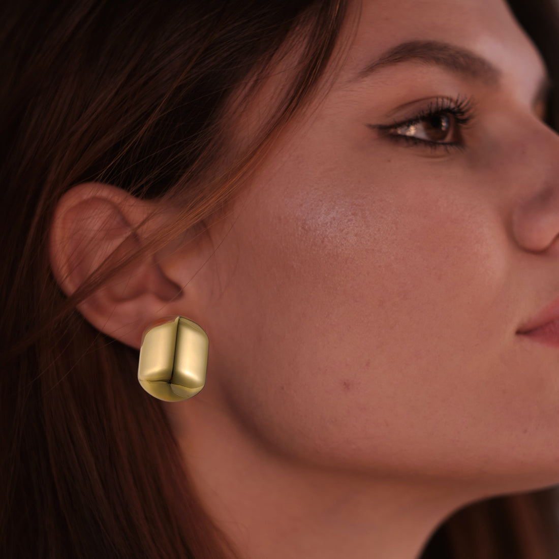 Golden, capsule-shaped earrings